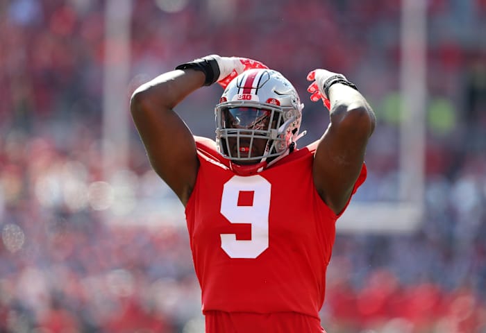 Ohio State Buckeyes defensive end Zach Harrison (9) celebrates during the second quarter against the Iowa Hawkeyes at Ohio Stadium.
